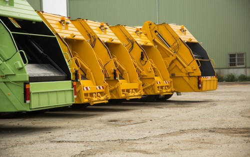 Worker sorting recyclable materials with local regulations in Richmond Upon Thames